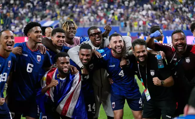 Cape Verde players celebrate their 0-0 draw with Saudi Arabia after the World Cup Group H soccer match in Houston, Friday, June 26, 2026. (AP Photo/David J. Phillip)