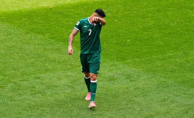 Iraq's Rebin Sulaka (2) walks off the field after being issued a red card during the World Cup Group I soccer match between Senegal and Iraq in Toronto, Friday, June 26, 2026. (Chris Young/The Canadian Press via AP)