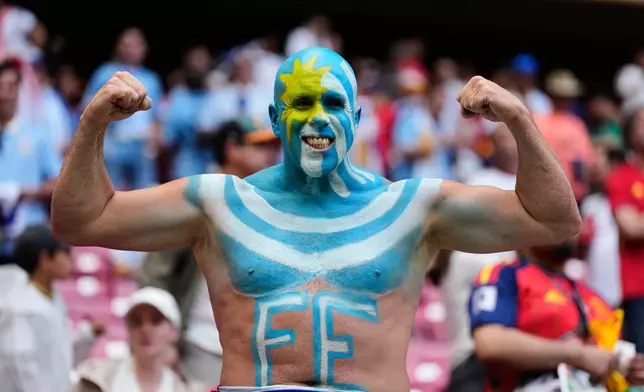 A fan of Uruguay poses prior to the World Cup Group H soccer match between Uruguay and Spain in Zapopan, near Guadalajara, Mexico, Friday, June 26, 2026. (AP Photo/Natacha Pisarenko)