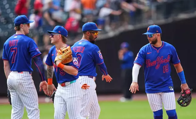 New York Mets' Bo Bichette, right, celebrates with teammates Marcus Semien, A.J. Ewing, second from left, and Brett Baty, left, after a baseball game against the St. Louis Cardinals Thursday, June 11, 2026, in New York. (AP Photo/Frank Franklin II)