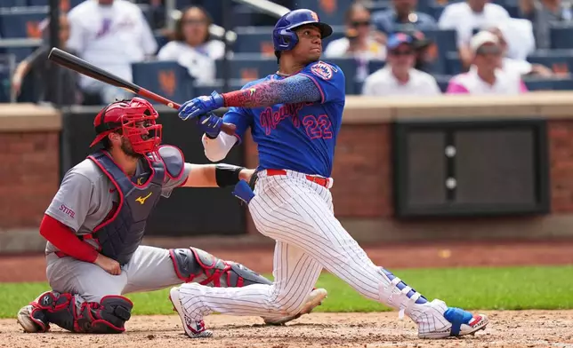 St. Louis Cardinals catcher Jimmy Crooks watches as New York Mets' Juan Soto follows through on a home run during the seventh inning of a baseball game Thursday, June 11, 2026, in New York. (AP Photo/Frank Franklin II)