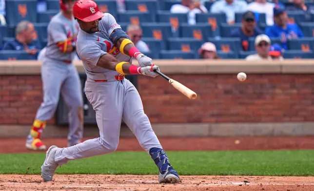 St. Louis Cardinals' Jordan Walker hits a single during the fifth inning of a baseball game against the New York Mets Thursday, June 11, 2026, in New York. (AP Photo/Frank Franklin II)