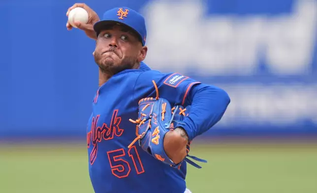 New York Mets pitcher Freddy Peralta throws during the second inning of a baseball game against the Atlanta Braves, Sunday, June 14, 2026, in New York. (AP Photo/Seth Wenig)