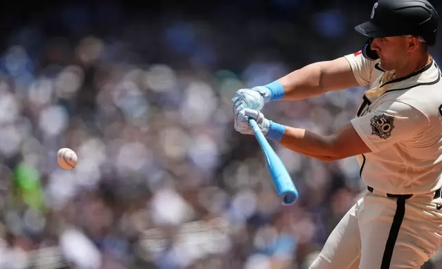 Seattle Mariners' Dominic Canzone hits a solo home run against the Boston Red Sox during the second inning of a baseball game, Sunday, June 21, 2026, in Seattle. (AP Photo/Lindsey Wasson)
