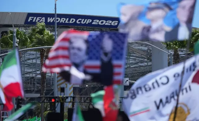 People protest outside Los Angeles Stadium before the World Cup Group G soccer match between Iran and New Zealand in Inglewood, Calif., near Los Angeles, Monday, June 15, 2026. (AP Photo/Jae C. Hong)