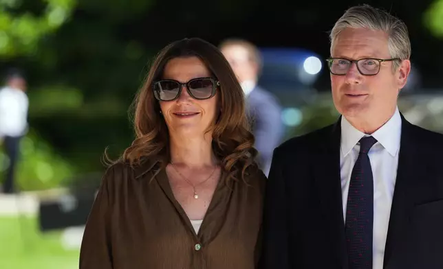 British Prime Minister Keir Starmer and his wife Victoria Starmer arrive for the G7 summit in Evian-les-Bains, France, Monday, June 15, 2026. (AP Photo/Thibault Camus)