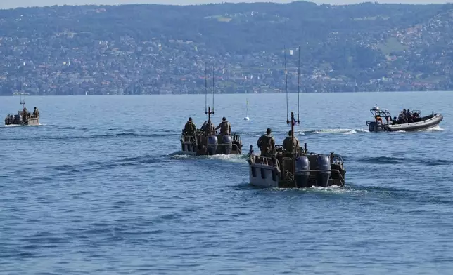 France's National Gendarmerie boats patrol on Lake Geneva ahead of the G7 summit in Evian-les-Bains, France, Monday, June 15, 2026. (AP Photo/Christophe Ena)