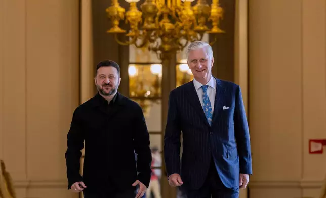 Belgium's King Philippe, right, and Ukraine's President Volodymyr Zelenskyy arrive for their meeting at the Royal Palace in Brussels, Thursday, June 18, 2026. (AP Photo/Geert Vanden Wijngaert)