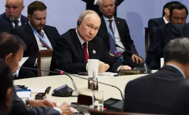 Russian President Vladimir Putin, center, attends the Russia-ASEAN summit in Kazan, Russia, Thursday, June 18, 2026. (Mikhail Metzel/Sputnik, Kremlin Pool Photo via AP)