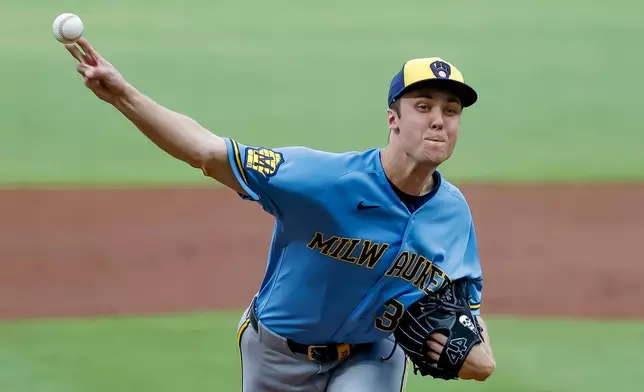 Milwaukee Brewers pitcher Jacob Misiorowski, right, delivers a pitch to Atlanta Braves' Matt Olson during the first inning of a baseball game, Friday, June 19, 2026, in Atlanta. (AP Photo/Erik S. Lesser)