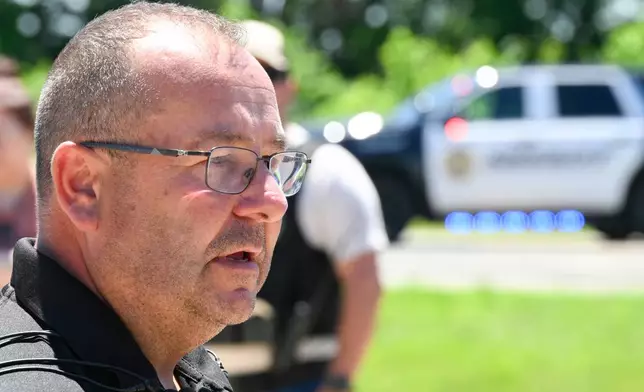 Bates County Sheriff Chad Anderson speaks at a press conference about the plane crash at Butler Memorial Airport, in Butler, Mo., Sunday, June 14, 2026. (AP Photo/Reed Hoffmann)