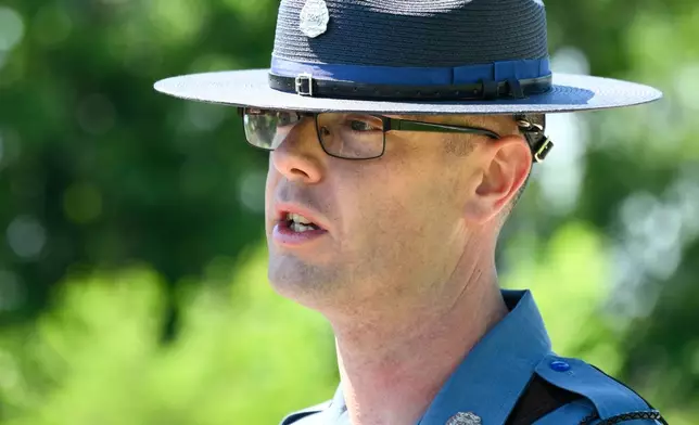Missouri State Highway Patrol Sergeant Justin Ewing talks to the media about the plane crash at Butler Memorial Airport, in Butler, Mo., Sunday, June 14, 2026. (AP Photo/Reed Hoffmann)