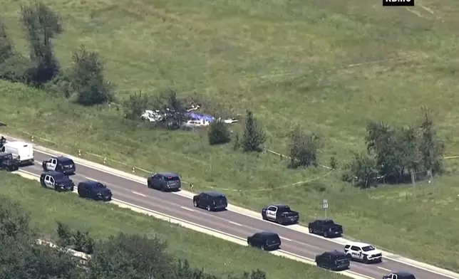 This video frame grab provided by KMBC-TV shows an aerial view of the crash scene near the Butler Memorial Airport in Butler, Mo., Sunday, June 14, 2026. (KMBC-TV via AP)