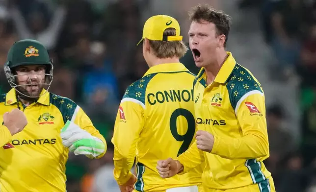 Australia's Matthew Kuhnemann, right, and teammates celebrates after the dismissal of Pakistan's Babar Azam during the third one-day international cricket match between Pakistan and Australia, in Lahore, Pakistan, Thursday, June 4, 2026. (AP Photo/K.M. Chaudary)