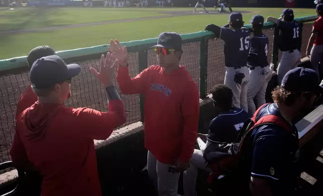 Stockton Ports' Shotaro Morii, middle, greets teammates during a Single A minor league baseball game against the San Jose Giants, May 20, 2026, in San Jose, Calif. (AP Photo/Jeff Chiu)