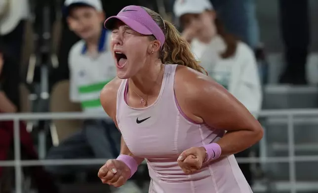 Russia's Mirra Andreeva reacts after winning during the semifinal tennis match against Ukraine's Marta Kostyuk at the French Open in Paris, Thursday, June 4, 2026. (AP Photo/Thibault Camus)
