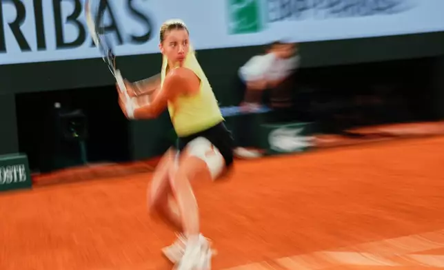 Poland's Maja Chwalinska returns to Russia's Diana Shnaider during the semifinal tennis match at the French Open in Paris, Thursday, June 4, 2026. (AP Photo/Christophe Ena)