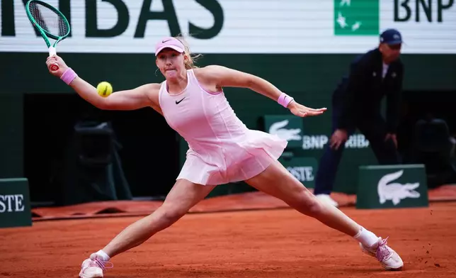 Russia's Mirra Andreeva returns to Ukraine's Marta Kostyuk during teh senifinal tennis tennis match at the French Open in Paris, Thursday, June 4, 2026. (AP Photo/Christophe Ena)