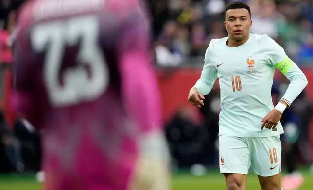 FILE - Kylian Mbappe of France runs during the international friendly soccer match between Brazil and France in Foxborough, Mass, March 26, 2026. (AP Photo/Charles Krupa, File)
