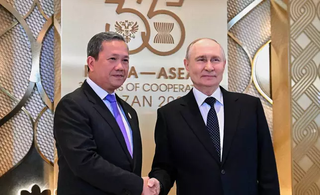 Russian President Vladimir Putin, right, and Cambodian Prime Minister Hun Manet pose for photo on the sidelines of the Russia-ASEAN summit in Kazan, Russia, Wednesday, June 17, 2026. (Sergei Bobylev/Sputnik, Kremlin Pool Photo via AP)