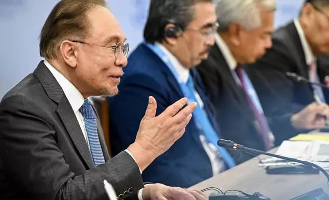 Malaysian Prime Minister Anwar Ibrahim gestures during a meeting with Russian President Vladimir Putin on the sidelines of the Russia-ASEAN summit in Kazan, Russia, Wednesday, June 17, 2026. (Sergei Bobylev/Sputnik, Kremlin Pool Photo via AP)