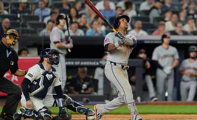 Cleveland Guardians' José Ramírez looks after his solo home run during the sixth inning of a baseball game against the New York Yankees, Wednesday, June 3, 2026, in New York. (AP Photo/Seth Wenig)