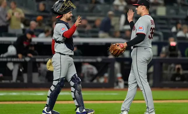 Cleveland Guardians pitcher Cade Smith, right, celebrates with catcher Patrick Bailey after a baseball game against the New York Yankees, Wednesday, June 3, 2026, in New York. (AP Photo/Seth Wenig)