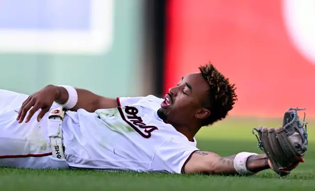 Washington Nationals second baseman Nasim Nuñez makes a diving catch of Kansas City Royals' Tyler Tolbert short fly ball during the second inning of a baseball game, Tuesday, June 16, 2026, in Washington. (AP Photo/John McDonnell)