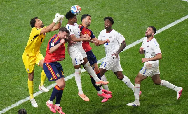 Cape Verde's Kevin Pina (6) heads the ball against Spain's Aymeric Laporte (14) during the World Cup Group H soccer match between Spain and Cape Verde in Atlanta, Monday, June 15, 2026. (AP Photo/Jacob Kupferman)