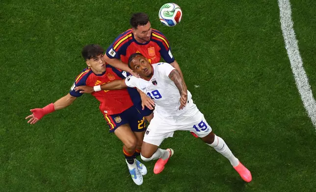 Cape Verde's Dailon Livramento, front, and Spain's Pau Cubarsi, left, battle for the ball during the World Cup Group H soccer match in Atlanta, Monday, June 15, 2026. (AP Photo/Colin Hubbard)