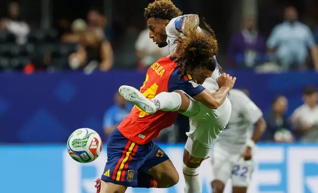 Spain's Marc Cucurella, left, and Cabo Verde's Ryan Mendes fight for the ball during the World Cup Group H soccer match between Spain and Cape Verde in Atlanta, Monday, June 15, 2026. (AP Photo/Erik S. Lesser)