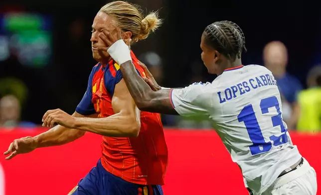 Cabo Verde's Sidny Lopes Cabral pushes Spain's Marcos Llorente during the World Cup Group H soccer match between Spain and Cape Verde in Atlanta, Monday, June 15, 2026. (AP Photo/Erik S. Lesser)