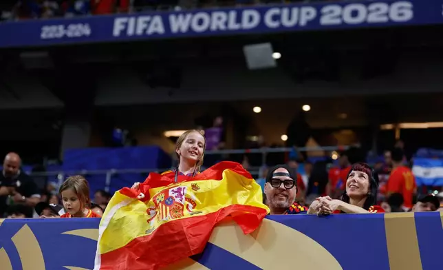A girl holds Spanish flag before the World Cup Group H soccer match between Spain and Cape Verde in Atlanta, Monday, June 15, 2026. (AP Photo/Erik S. Lesser)