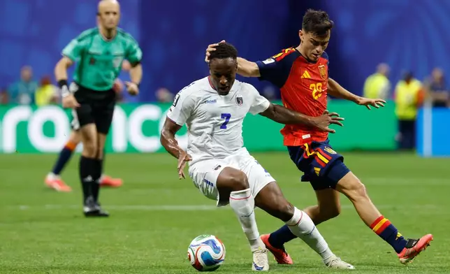 Cabo Verde's Jovane Cabral, left, and Spain's Pedri fight for the ball during the World Cup Group H soccer match between Spain and Cape Verde in Atlanta, Monday, June 15, 2026. (AP Photo/Erik S. Lesser)