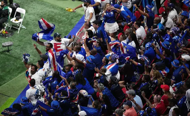 Cape Verde fans cheer during the World Cup Group H soccer match between Spain and Cape Verde in Atlanta, Monday, June 15, 2026. (AP Photo/Jacob Kupferman)