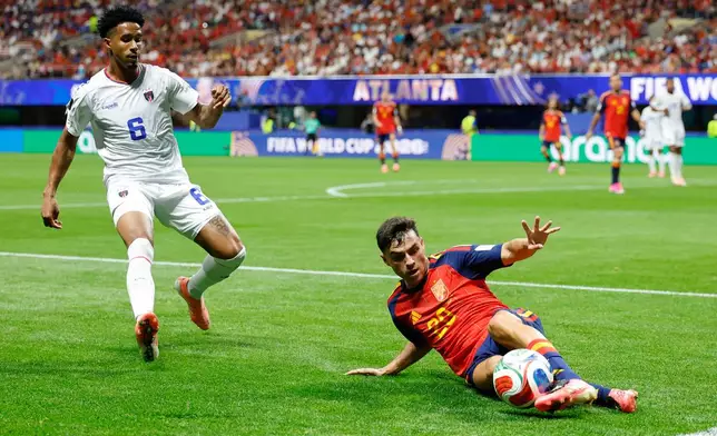 Spain's Pedri tries to save the ball in front of Cabo Verde's Kevin Pina during the World Cup Group H soccer match between Spain and Cape Verde in Atlanta, Monday, June 15, 2026. (AP Photo/Erik S. Lesser)
