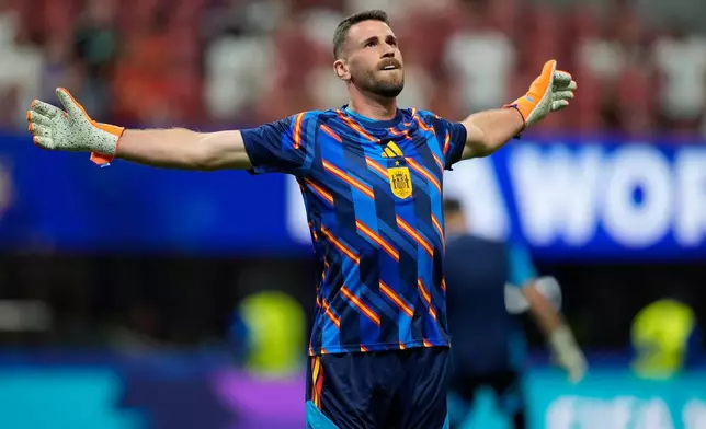Spain goalkeeper Unai Simon (23) warms up before the start of the World Cup Group H soccer match between Spain and Cape Verde in Atlanta, Monday, June 15, 2026. (AP Photo/Mike Stewart)