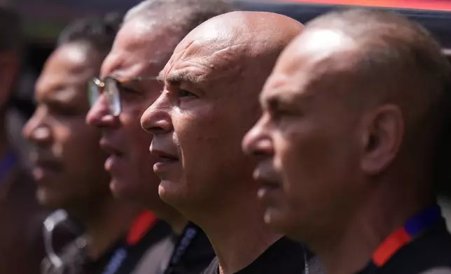 Egypt head coach Hossam Hassan, second left, with his other coaches on the sidelines during the World Cup Group G soccer match between Belgium and Egypt in Seattle, Monday, June 15, 2026. (AP Photo/Manu Fernandez)