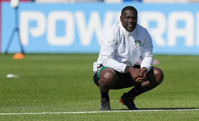 Ivory Coast head coach Emerse Fae watches a training session on the eve of the team's World Cup soccer match against Germany, Friday, June 19, 2026, in Toronto. (AP Photo/Stephanie Scarbrough)