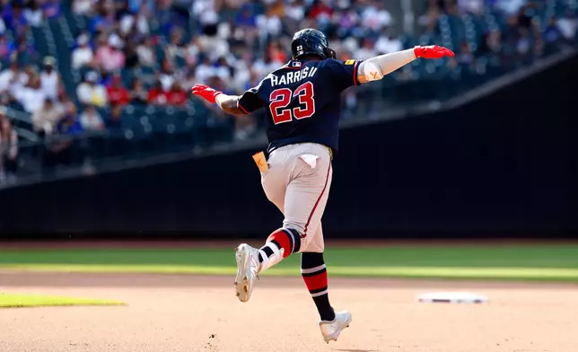 Atlanta Braves' Michael Harris II reacts while rounding the bases after hitting a home run against the New York Mets during the eighth inning of a baseball game, Saturday, June 13, 2026, in New York. (AP Photo/Noah K. Murray)