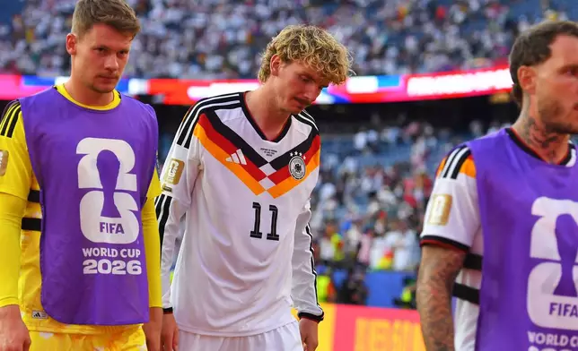 Germany's Nick Woltemade (11) walks off the field after losing to Paraguay in a shootout during the World Cup round of 32 soccer match in Foxborough, Mass., near Boston, Monday, June 29, 2026. (AP Photo/Steven Senne)