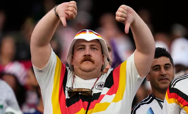 A Germany fan reacts at the end of the World Cup round of 32 soccer match between Germany and Paraguay in Foxborough, Mass., near Boston, Monday, June 29, 2026. (AP Photo/Charles Krupa)