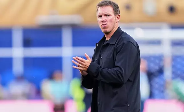 Germany head coach Julian Nagelsmann claps hands to supporters after losing the World Cup round of 32 soccer match between Germany and Paraguay in Foxborough, Mass., near Boston, Monday, June 29, 2026. (AP Photo/Martin Meissner)