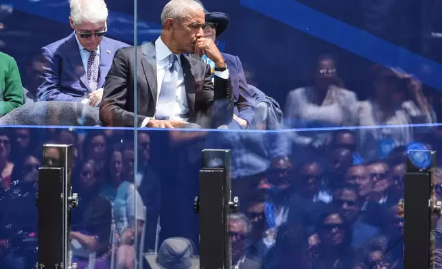 Former President Barack Obama gets emotional as his wife, former first lady Michelle Obama, speaks during the dedication ceremony for the Obama Presidential Center, Thursday, June 18, 2026, in Chicago. (AP Photo/Jeff Roberson)