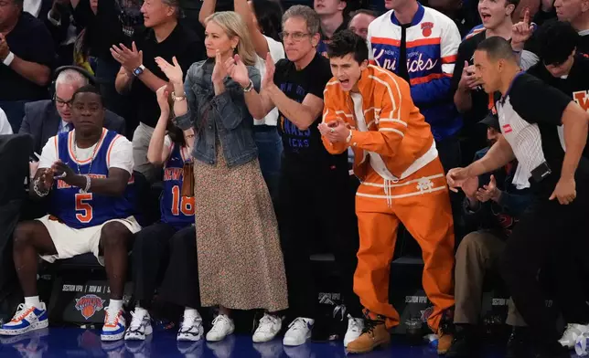 Timothee Chalamet, right, and Ben Stiller cheer during Game 3 of the NBA Finals basketball series between the San Antonio Spurs and the New York Knicks, Monday, June 8, 2026, in New York. (AP Photo/Ross D. Franklin)