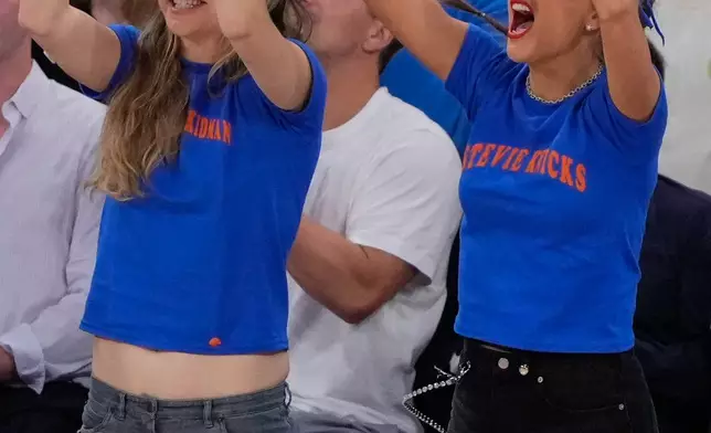 Este Haim and Taylor Swift cheer during the first half of Game 4 of the NBA Finals basketball series between the San Antonio Spurs and the New York Knicks, Wednesday, June 10, 2026, in New York. (AP Photo/Ross D. Franklin)