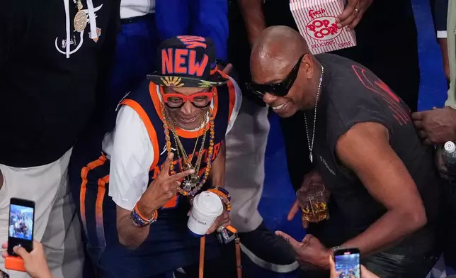 Filmmaker Spike Lee, left, and comedian Dave Chappelle, arrive prior to Game 3 of the NBA Finals basketball series between the San Antonio Spurs and the New York Knicks, Monday, June 8, 2026, in New York. (AP Photo/Yuki Iwamura)