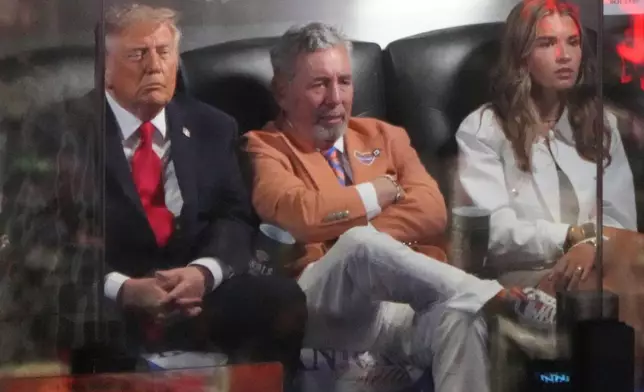 President Donald Trump watches Game 3 of the NBA Finals basketball series between the New York Knicks and the San Antonio Spurs at Madison Square Garden in New York, Monday, June 8, 2026, with Knicks owner James Dolan and Kai Trump. (AP Photo/Mark Schiefelbein)