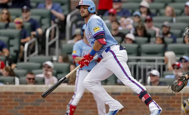 Atlanta Braves' Austin Riley hits an RBI double against the Pittsburgh Pirates during the first inning of a baseball game, Saturday, June 6, 2026, in Atlanta. (AP Photo/Erik S. Lesser)