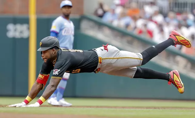 Pittsburgh Pirates' Oneil Cruz steals second base against the Atlanta Braves during the second inning of a baseball game, Saturday, June 6, 2026, in Atlanta. (AP Photo/Erik S. Lesser)